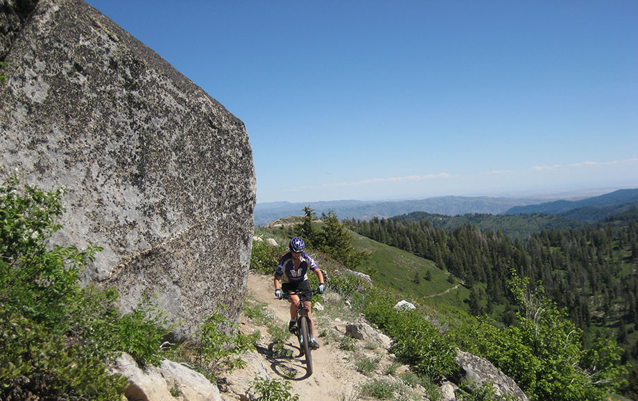 Mountain biker near Bogus Basin, Idaho. Mountain biking in Boise can range from hard-packed sand and gravel trails in sagebrush terrain to pine forest single track.