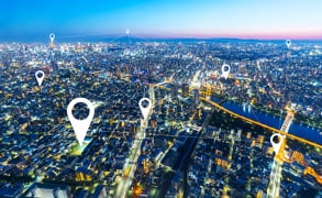 GPS tracking in the workplace is increasing worldwide. Photo of a nighttime cityscape.