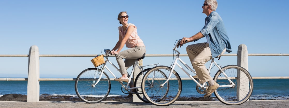 The study showed Canadian and U.S. PTO policies are similar. Workers in Australia, however, receive 16 - 20 days of PTO. Photo of couple riding bikes by the ocean